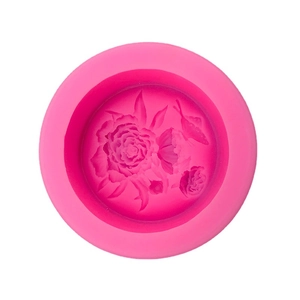 Round rose pink silicone mold featuring 3D butterfly and flower relief for DIY crafts