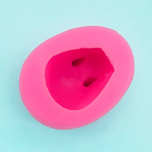 Detail of pink silicone mold with 3D animal nose shape for cake baking and DIY crafts