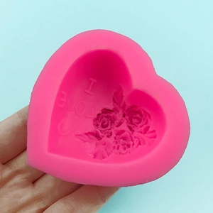 Pink heart-shaped silicone mold with rose flower relief and I LOVE text for DIY crafts