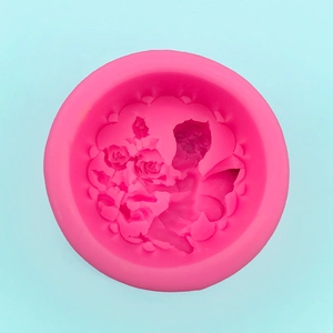 Macro detail of pink silicone mold featuring intricate rose bouquet patterns for DIY soap