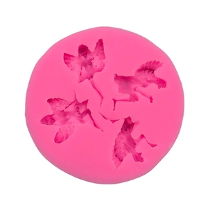 Pink silicone mold featuring four fairy and angel shapes for fondant and cake decorating