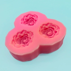 Pink silicone mold featuring three distinct rose flower patterns for cake decorating