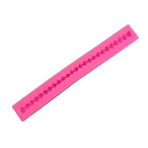 Pink silicone fondant mold featuring intricate long strip lace border patterns for cake DIY