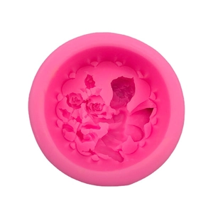 Pink silicone angel mold for DIY crafts showing detailed rose flower cluster texture