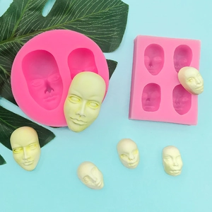 Pink silicone face molds for fondant and soap making with realistic facial details