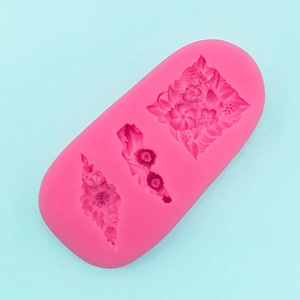Macro detail of pink silicone cake mold with floral leaf patterns for DIY fondant crafting