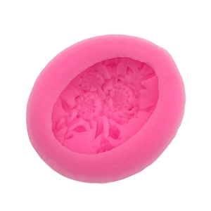 Pink oval silicone mold with detailed flower pattern for DIY cake decorating and crafts