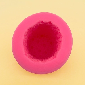 Macro detail of pink bubble column silicone mold showing honeycomb inner texture