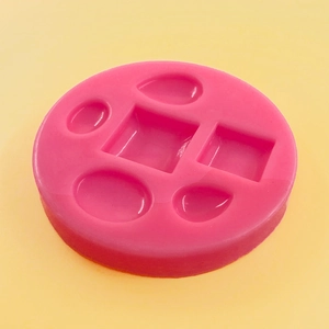 Pink silicone mold with geometric oval and square shapes for DIY jewelry and cake decor