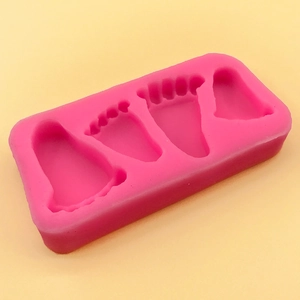 Pink silicone baby footprint mold for DIY cake decorating and resin crafting projects