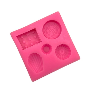 Pink silicone mold featuring cookie, shell and round shapes for DIY fondant and wax