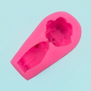 Pink silicone mold detail showing intricate cartoon clown cavity for DIY baking and crafts