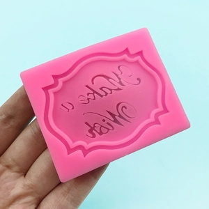 Pink silicone mold featuring decorative Make a Wish text for cake fondant and DIY crafts