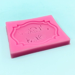 Pink silicone mold featuring decorative wave border and Thank You artistic lettering