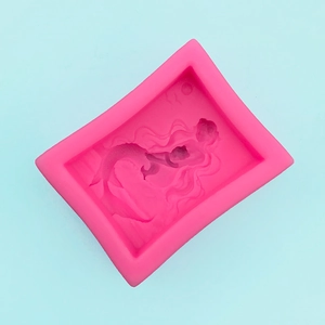 Detail of pink silicone mermaid mold with intricate textures for soap and cake making