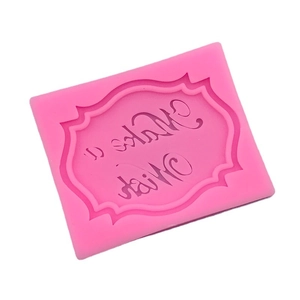 Pink silicone mold featuring a wavy frame and Make a Wish text for cake decoration