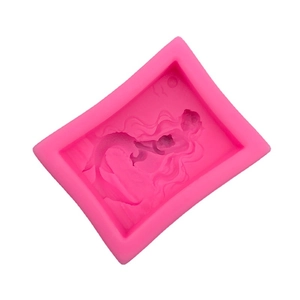 Bright pink silicone mold for DIY mermaid soap and chocolate with detailed relief patterns