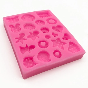 Pink silicone mold with heart and star cavities for DIY fondant and chocolate making