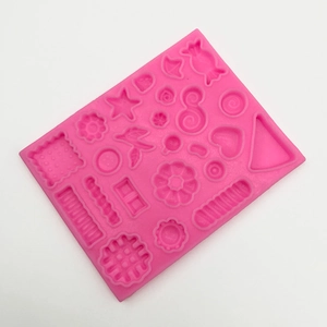 Pink silicone mold with heart, star and candy shapes for DIY chocolate and cake decoration