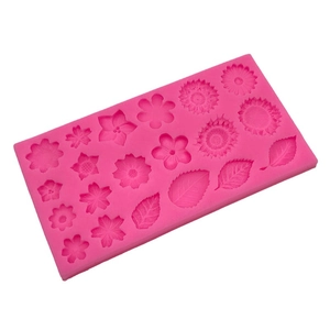 Pink silicone mold with flower and leaf shapes for DIY cake fondant and wax seal crafting