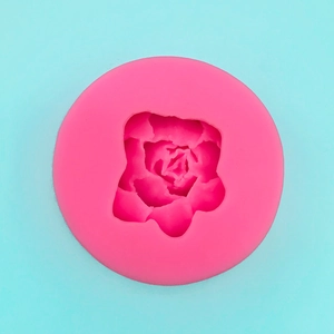 Top view of a pink rose-shaped silicone mold for DIY cake, chocolate and handmade soap crafts
