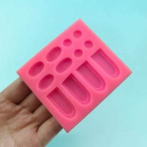 Pink silicone mold for rabbit ear fondant decorations with multiple cavities for baking