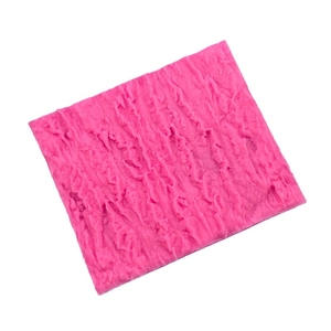 Pink silicone mold featuring realistic bark texture for DIY cake decorating and baking