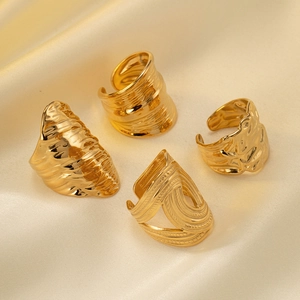 Set of four gold-plated irregular hammered and wavy textured adjustable open rings