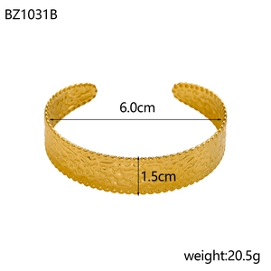 Detail showing 6.0cm inner diameter and 1.5cm width of golden hammered cuff bracelet