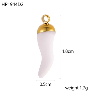 Detail of white cornicello pendant with gold cap measuring 1.8cm by 0.5cm and 1.7g