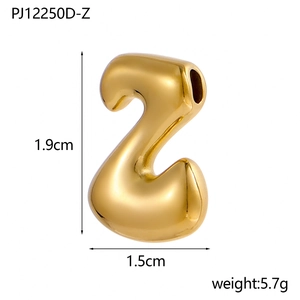 Macro shot of gold bubble Z letter pendant with dimensions 1.9cm by 1.5cm for DIY jewelry