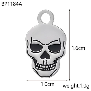Detailed size view of silver skull pendant measuring 1.6cm by 1.0cm with top ring