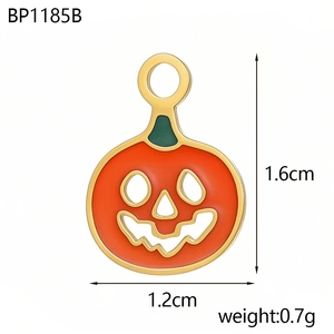 Detail of Jack-o'-lantern pendant showing 1.6cm height and green enamel pumpkin leaves