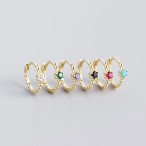 Set of six gold S925 huggie hoop earrings with colorful round-cut gemstones and bead texture