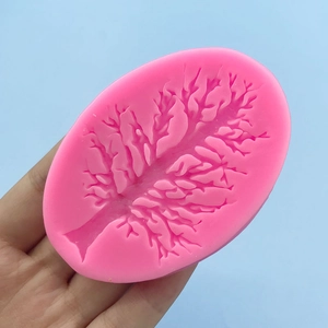 Pink silicone Christmas tree branch mold for cake decorating and chocolate baking