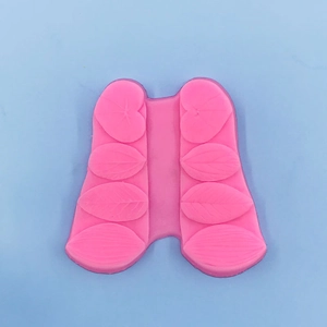 Macro shot of pink silicone leaf mold with various leaf vein textures for cake fondant