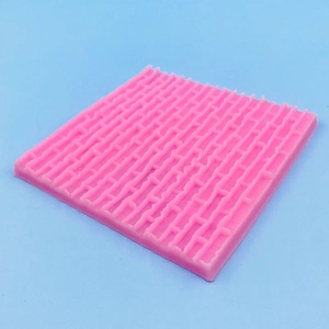 Stampo quadrato in silicone rosa con trama a mattoni per fondente e pasticceria