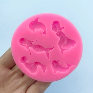 Pink silicone mold featuring various mermaid and dolphin shapes for cake baking and DIY crafts