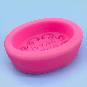 Pink handmade soap silicone mold with oval shape and elegant engraved pattern