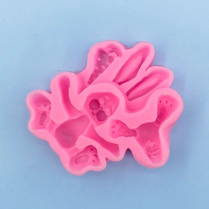 Pink silicone mold with multi-shape paw and flower cavities for DIY chocolate or crafts