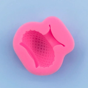 Detailed view of pink silicone vase mold with diamond texture for fondant and baking