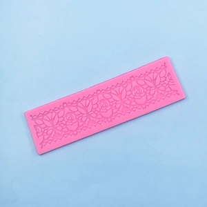 Detail showing pink floral lace silicone mold for fondant cake and handmade soap texture