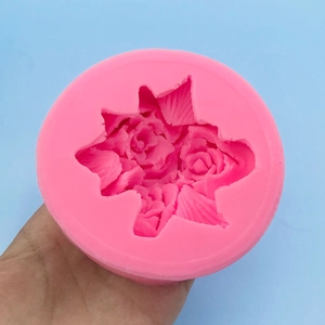 Pink silicone mold for three roses and leaves for cake decoration and candle making