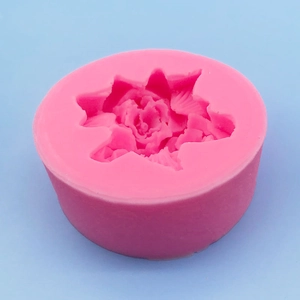 Pink silicone mold featuring 3D rose flower designs for cake decorating and candles