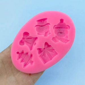Pink silicone mold featuring 5 Christmas patterns including snowman and tree for baking