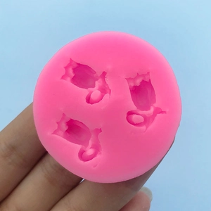 Pink silicone mold with three tulip flower shapes for DIY chocolate and cake decorating