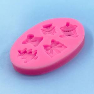 Pink silicone mold for Christmas fondant and chocolate baking featuring trees and bows