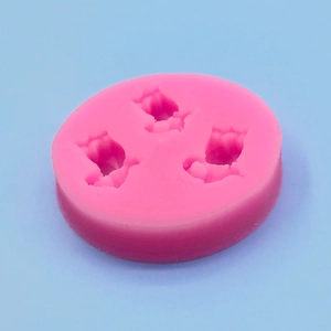 Pink silicone mold with triple tulip shape for DIY fondant, chocolate, and cake decorating