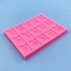 Pink silicone mold featuring Happy Birthday flag banner shapes for cake fondant and chocolate