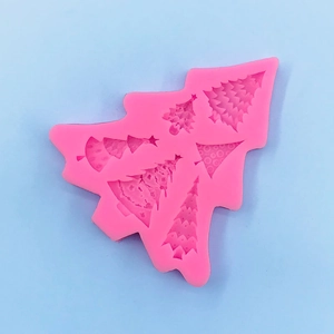 Macro view of 5-cavity pink silicone Christmas tree mold for DIY baking and crafts